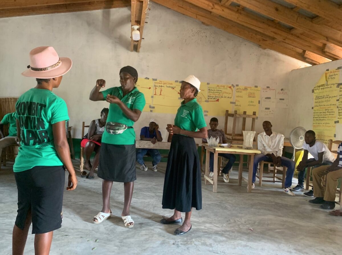 Agroecology Educators Miglita Etienne, Yvrose Edoursaint, and Luni Prophet perform Little Theatre -- a method for teaching about benefits of different regenerative agroecology techniques-- at a recent Agroecology Workshop.